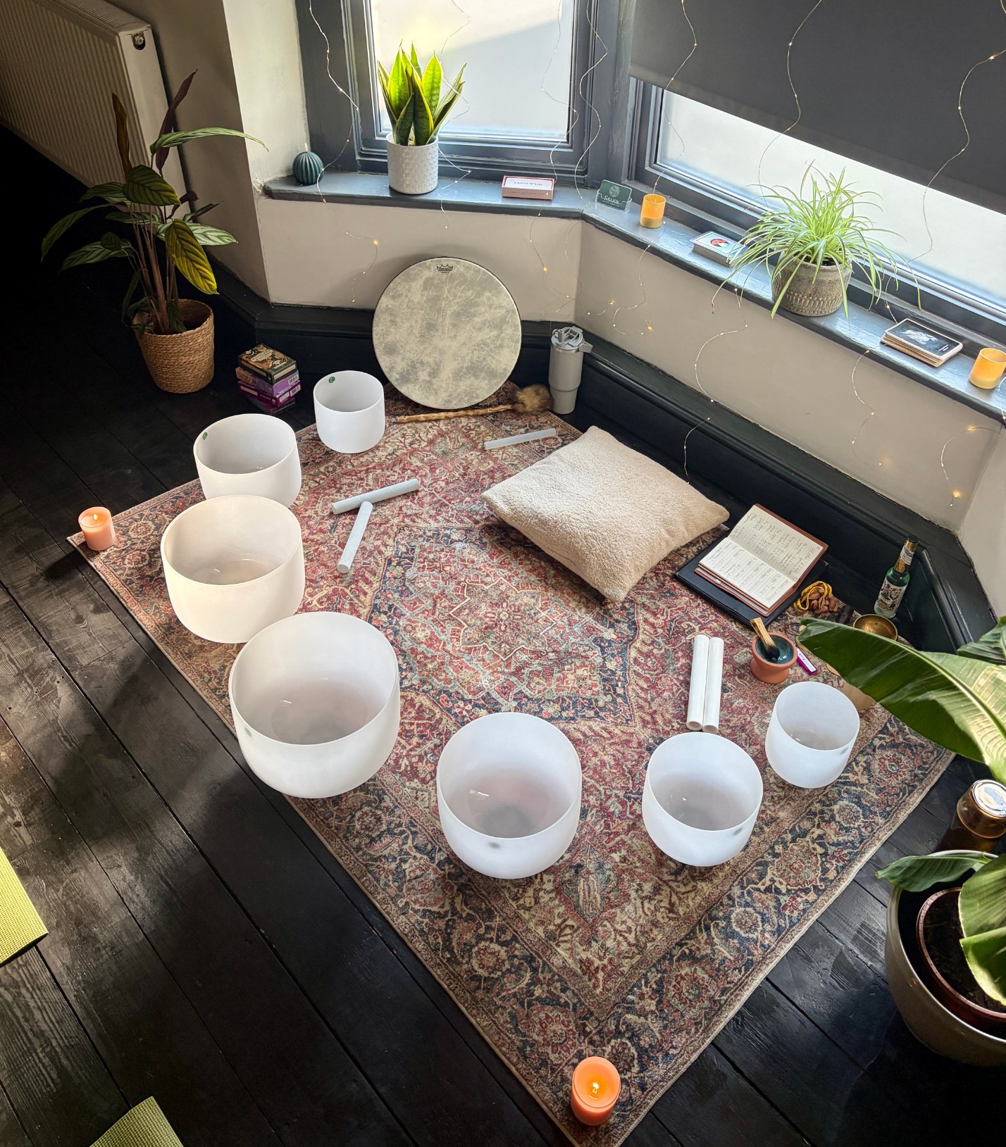 Crystal singing bowls on a rug in the bay window